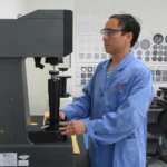 An Asian man testing hardness of the products