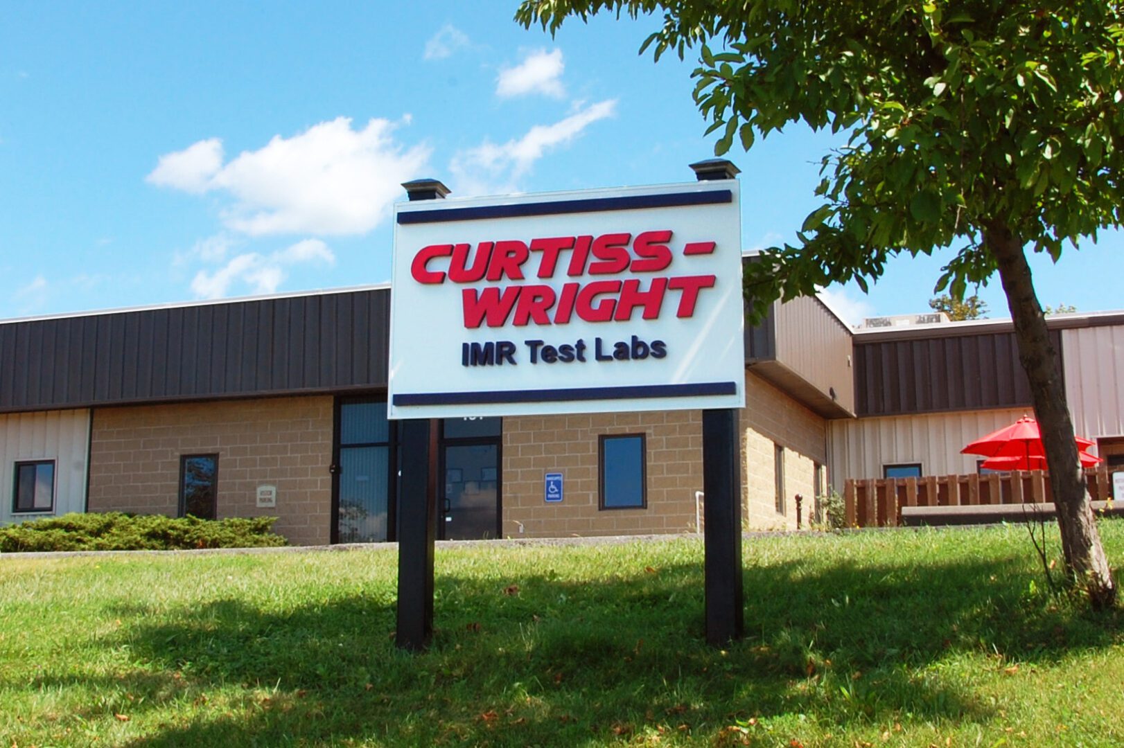 Curtiss Wright IMR Test Labs sign in front of Ithaca, NY lab
