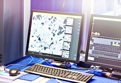 Desktop computer with close-up SEM image for metallurgical analysis
