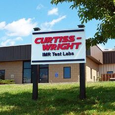 Curtiss Wright IMR Test Labs sign in front of Ithaca, NY lab