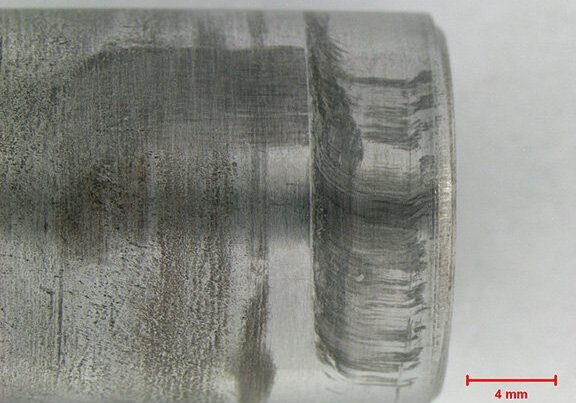 Wear marks on pin indicating rotational forces were applied to the OD_0